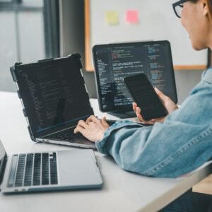 Female programmer working on coding, software development and web design.