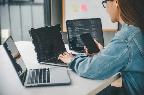 Female programmer working on coding, software development and web design.
