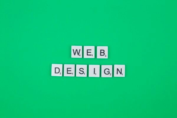 Web design scrabble letters word on a green background